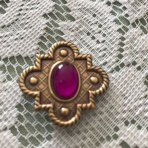 One button cover goldtone purple stone.  1 1/4 in